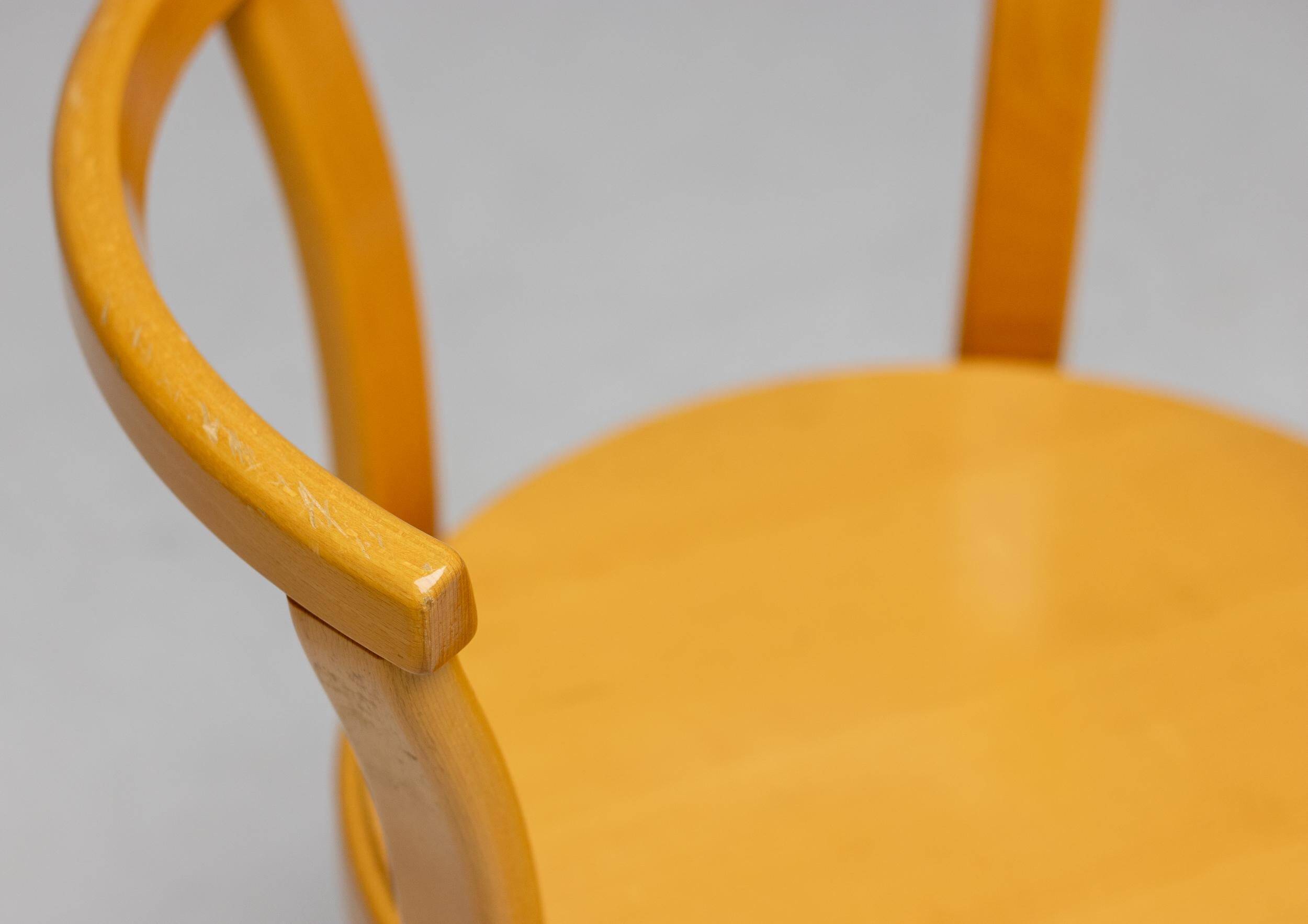 Stackable chairs in curved beech.