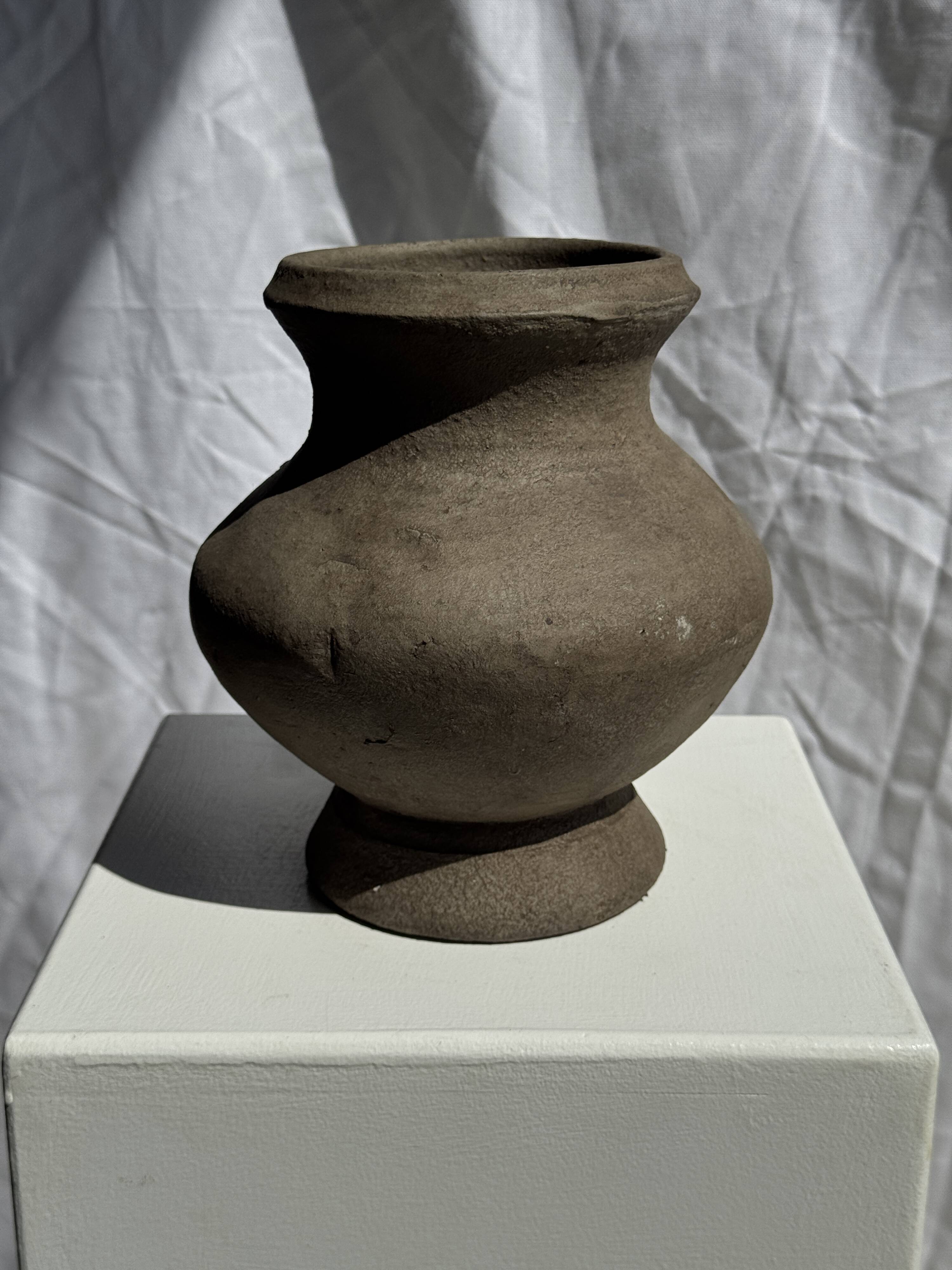 Small brutalist handcrafted terracotta vase with a pedestal, Indonesian, H19 D17.