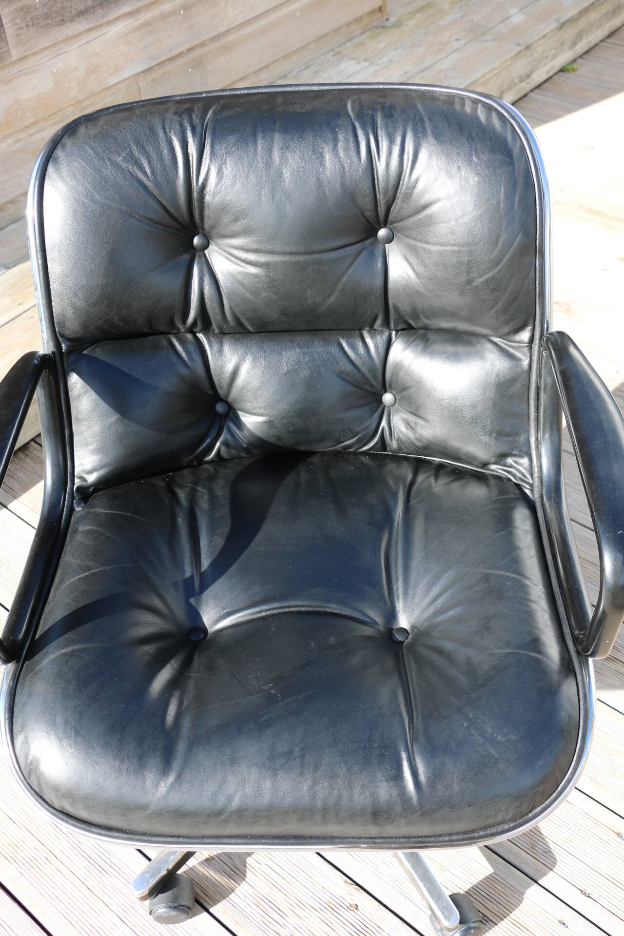 POLLOCK black leather reclining armchair with casters