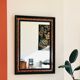 Old wall mirror 72 x 52 cm in black wood and faux mahogany