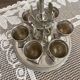 Set de coquetiers argentés avec cuillères et support
