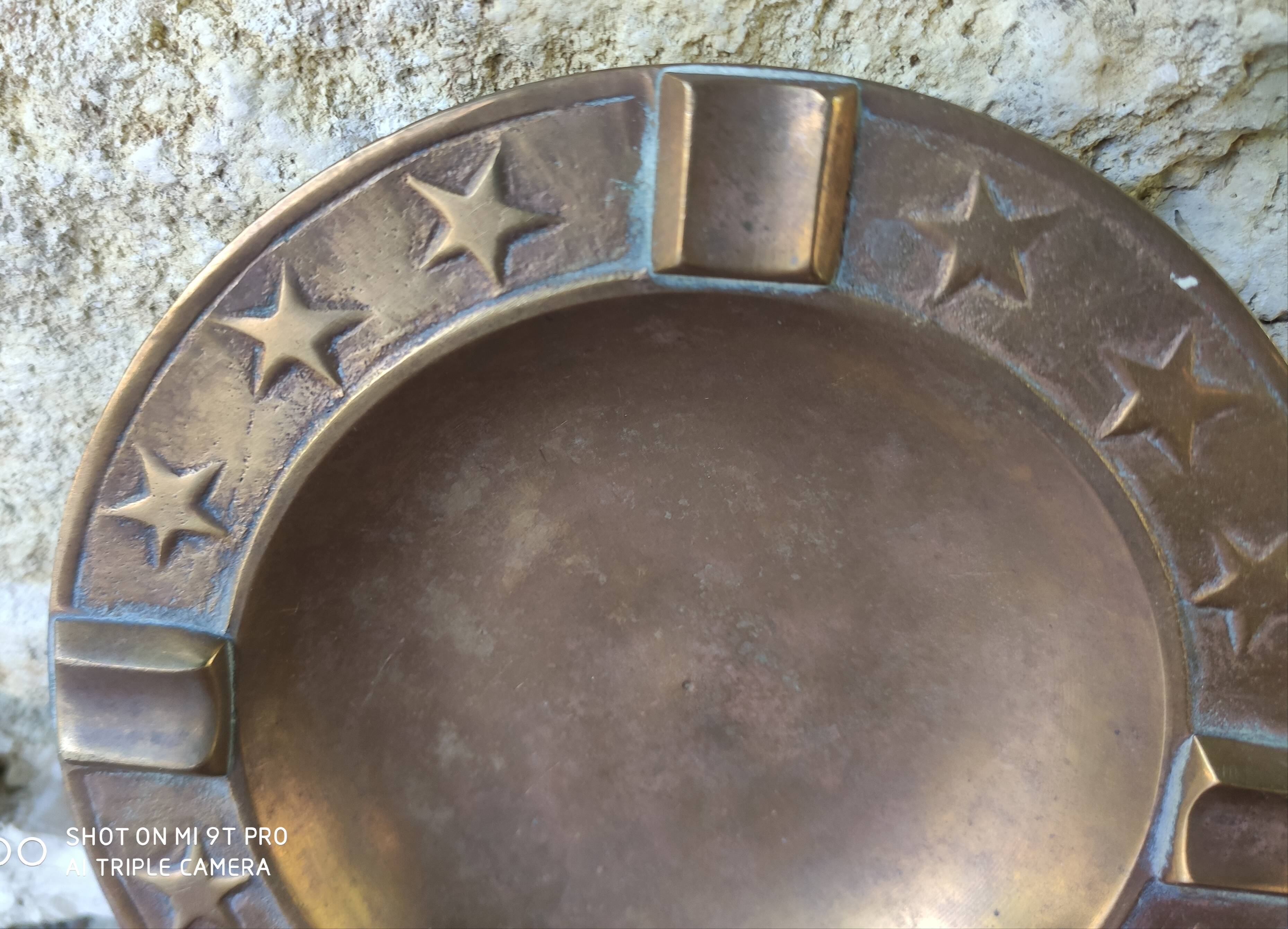 Brass ashtray with stars