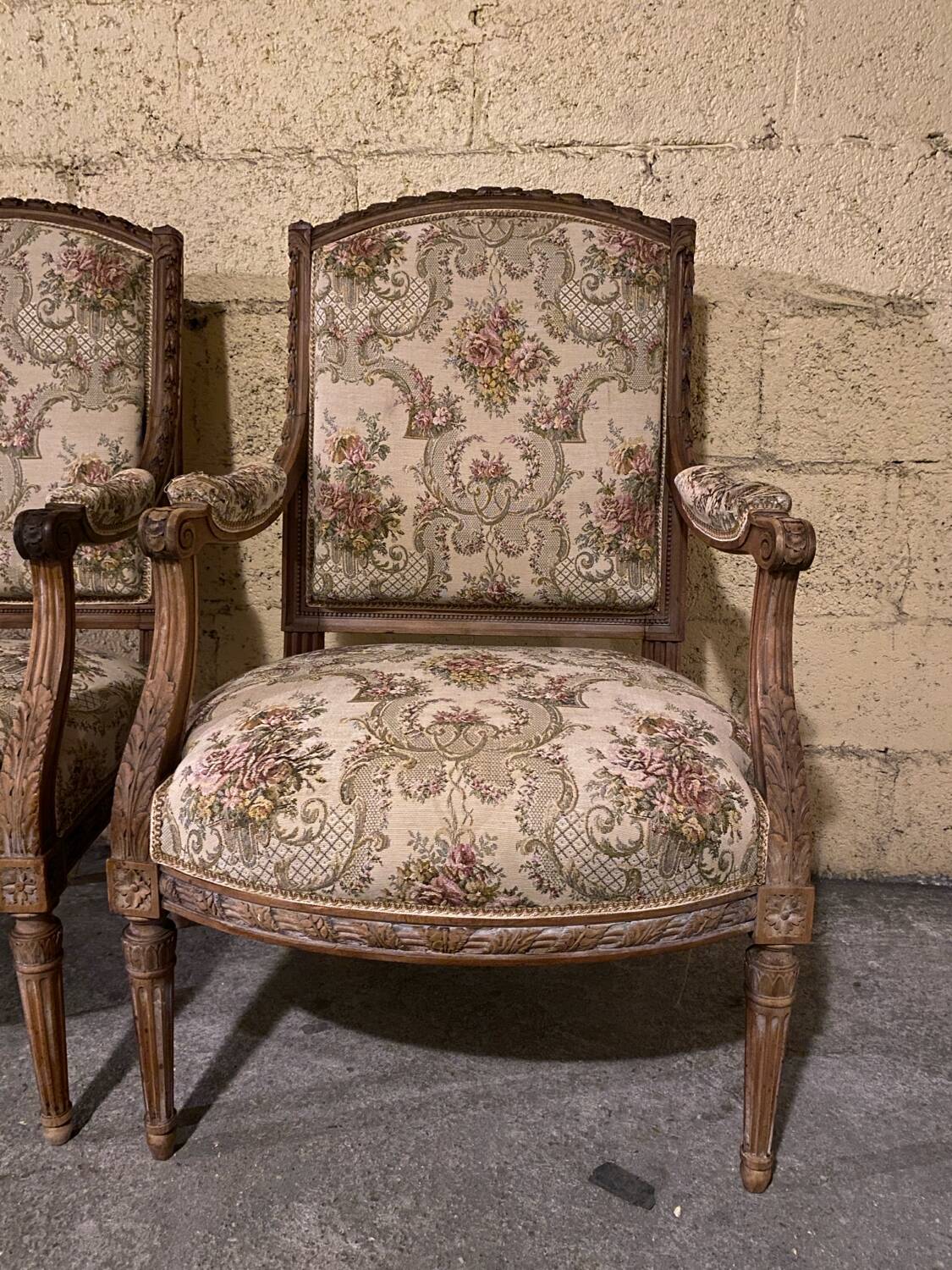 Pair of antique carved wooden armchairs