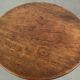 Round antique side/wine table from the late 18th century with a subtle foot