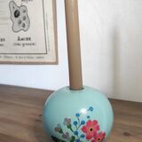 Floral candle holder in enamelled metal