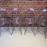 Suite of four plexiglass and metal chairs