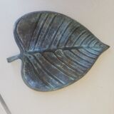 Greenish metal leaf pocket emptier