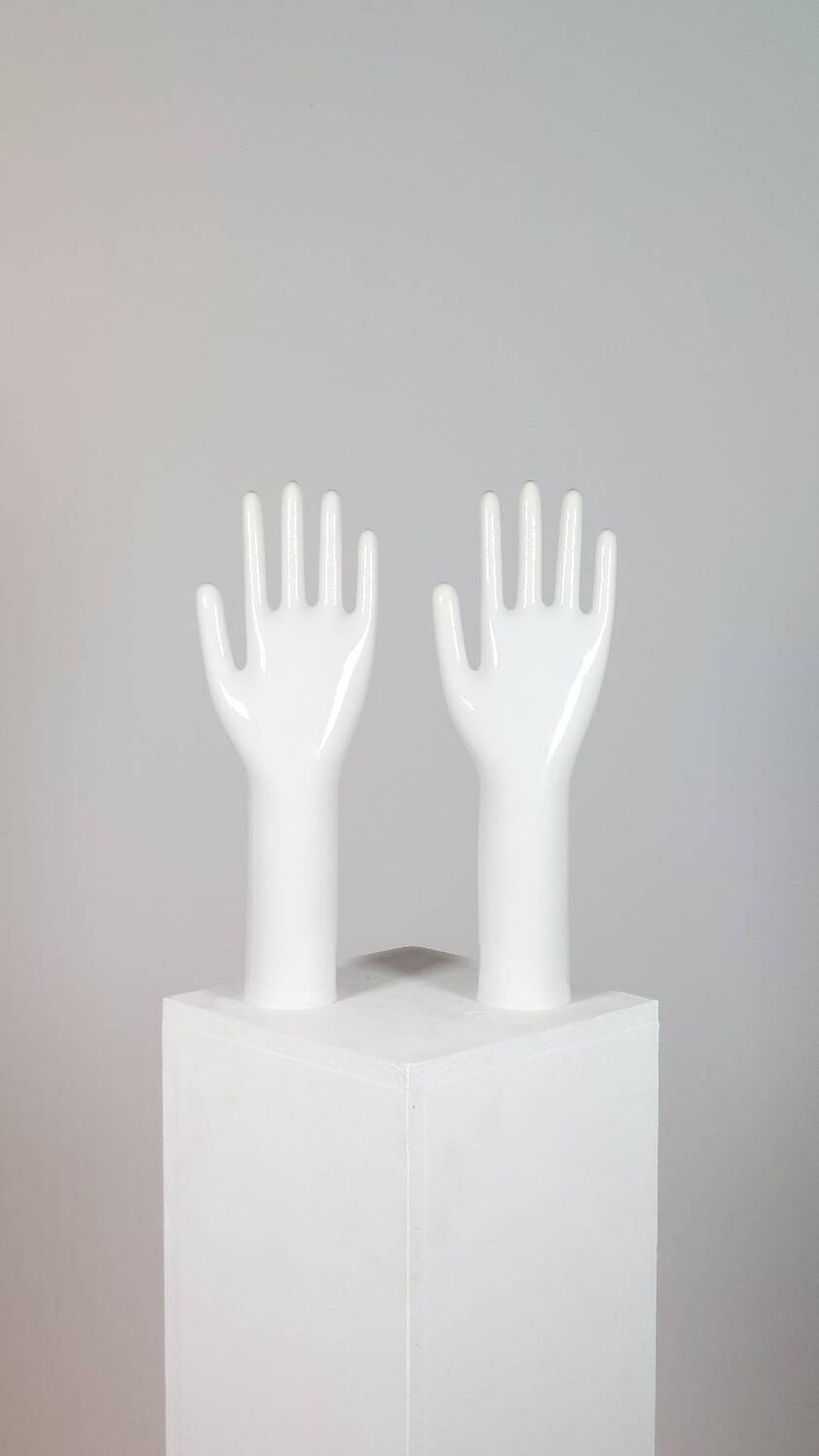 Pair of authentic vintage jewellery displays in industrial porcelain representing hands.
