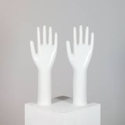 Pair of authentic vintage jewellery displays in industrial porcelain representing hands.