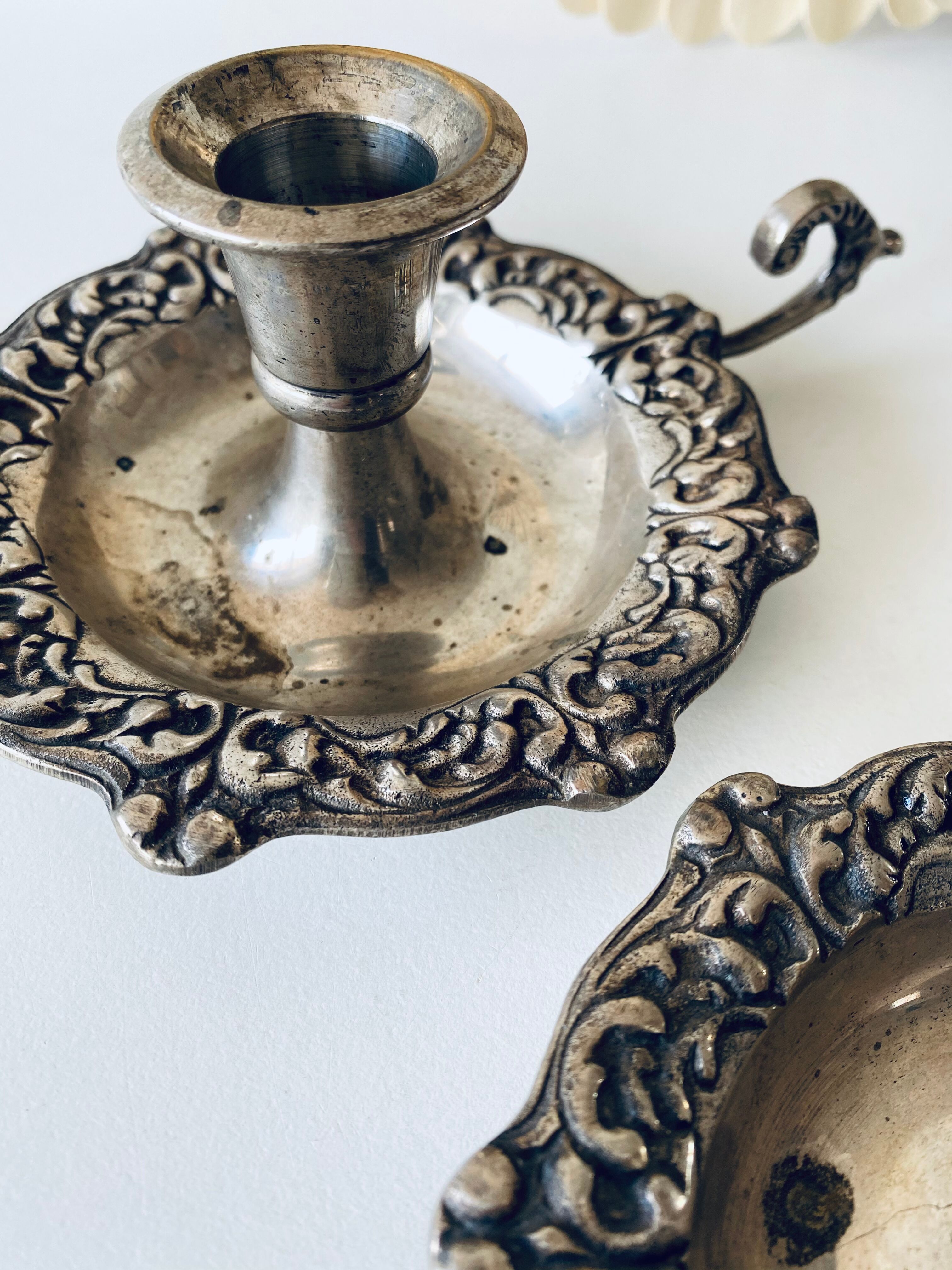 Pair of silver metal candlesticks