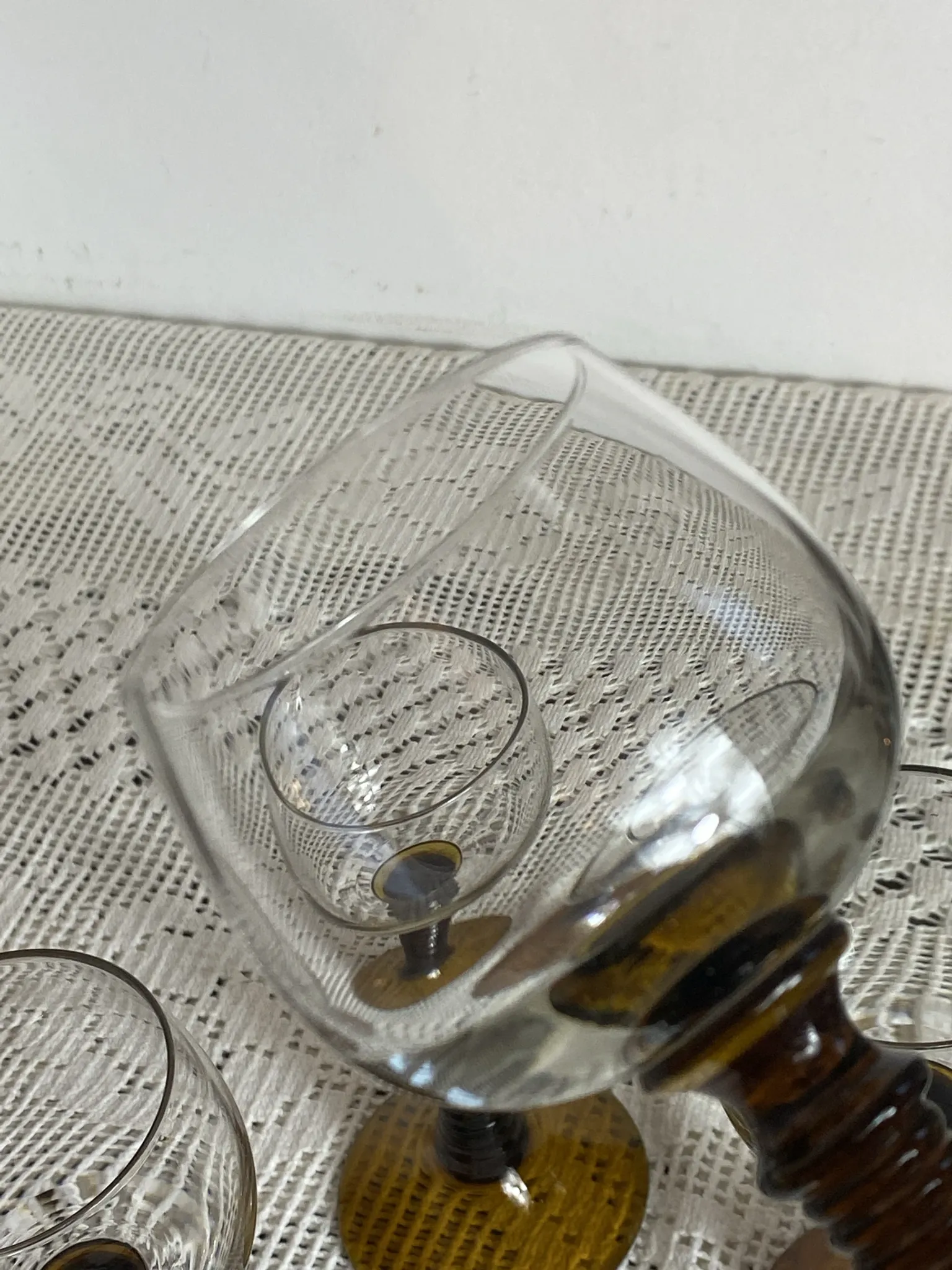 Footed glasses of the Roemer type, amber colour