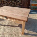 Low farmhouse table in raw wood
