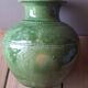 Ancient vase in glazed terracotta with green glaze.