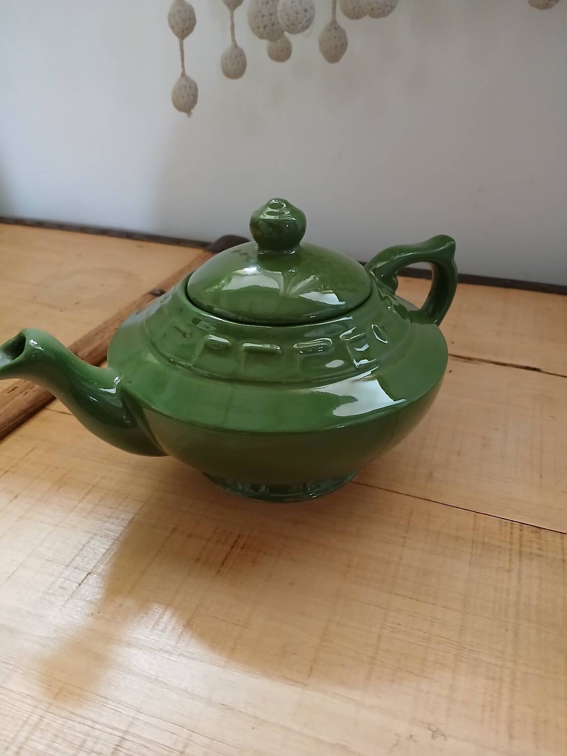 Green earthenware teapot
