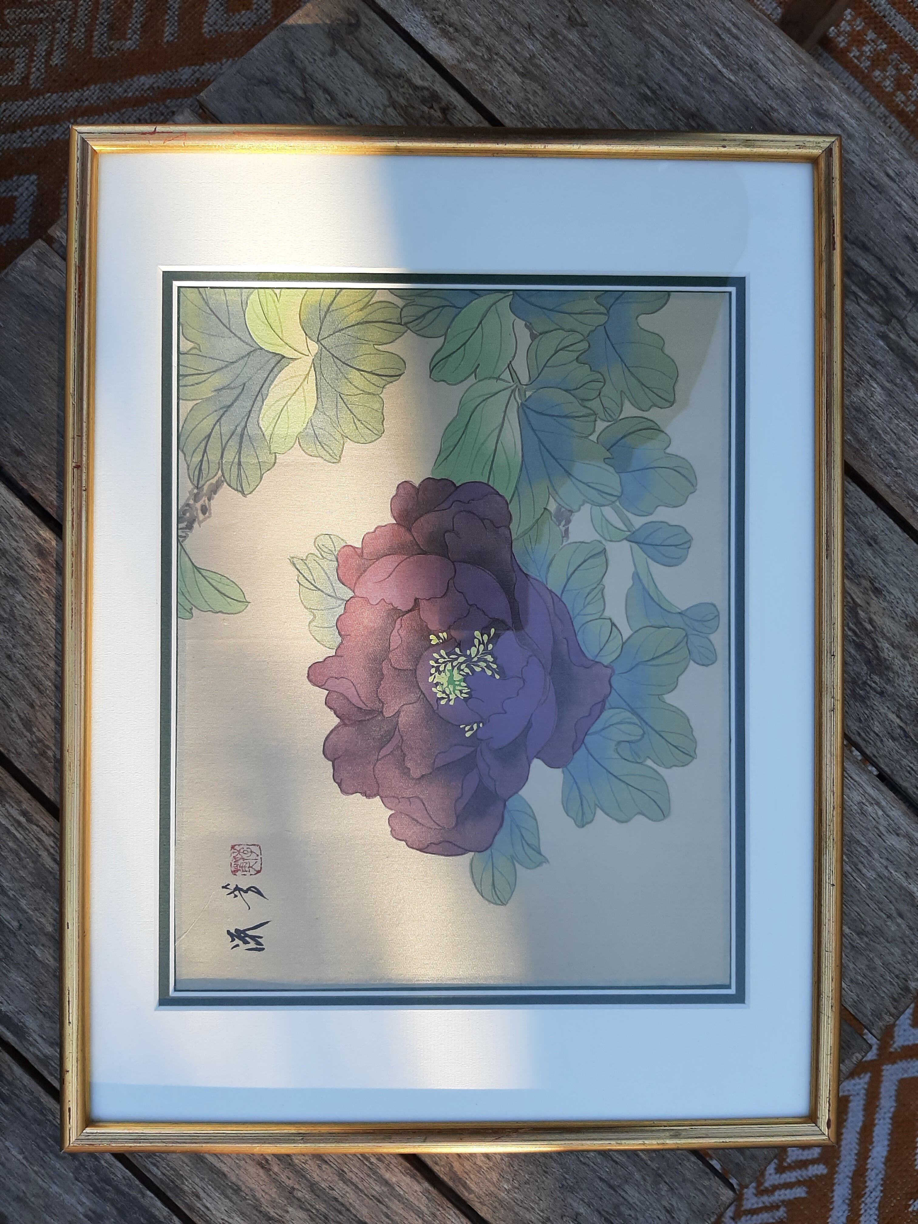 Chinese print purple flower under golden frame