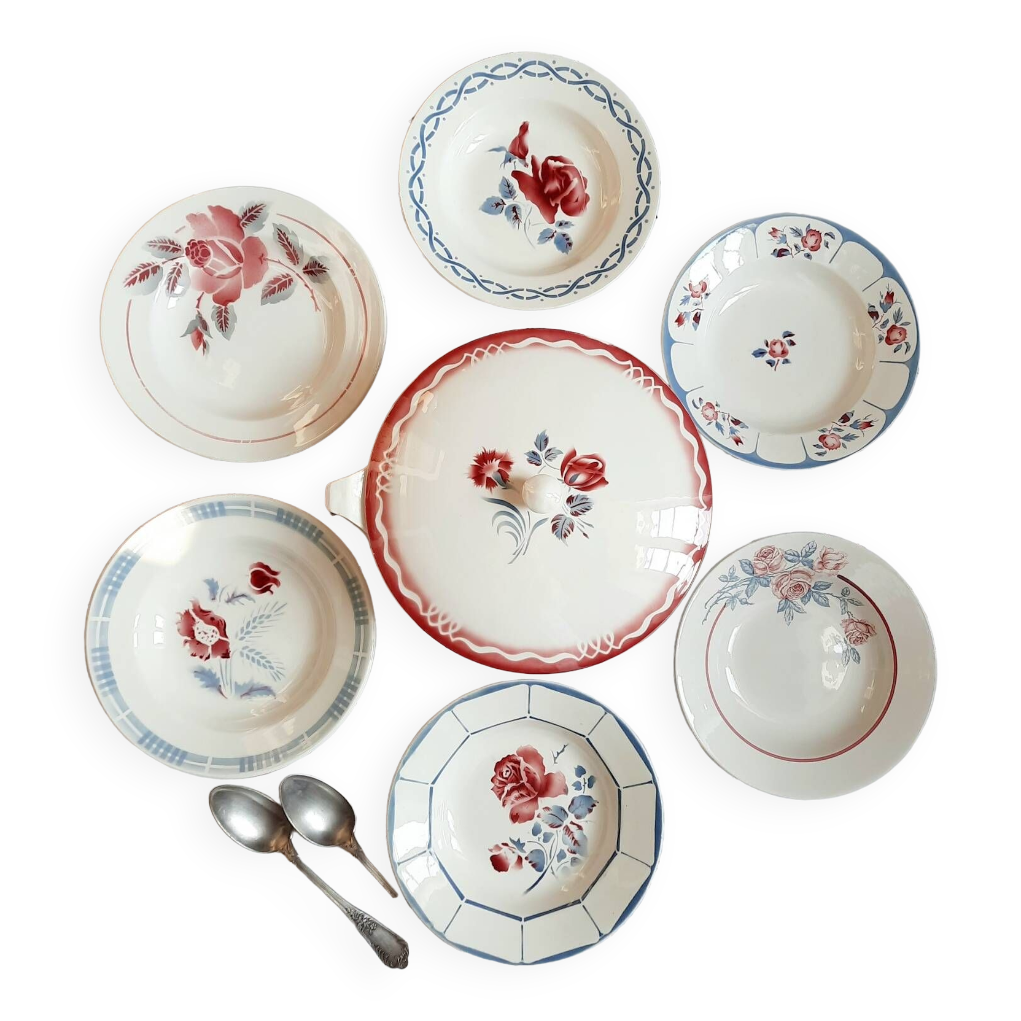 Mismatched old soup plates accompanied by a soup tureen