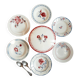 Mismatched old soup plates accompanied by a soup tureen