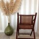 Fauteuil pliant en bambou, cannage, cuir et laiton