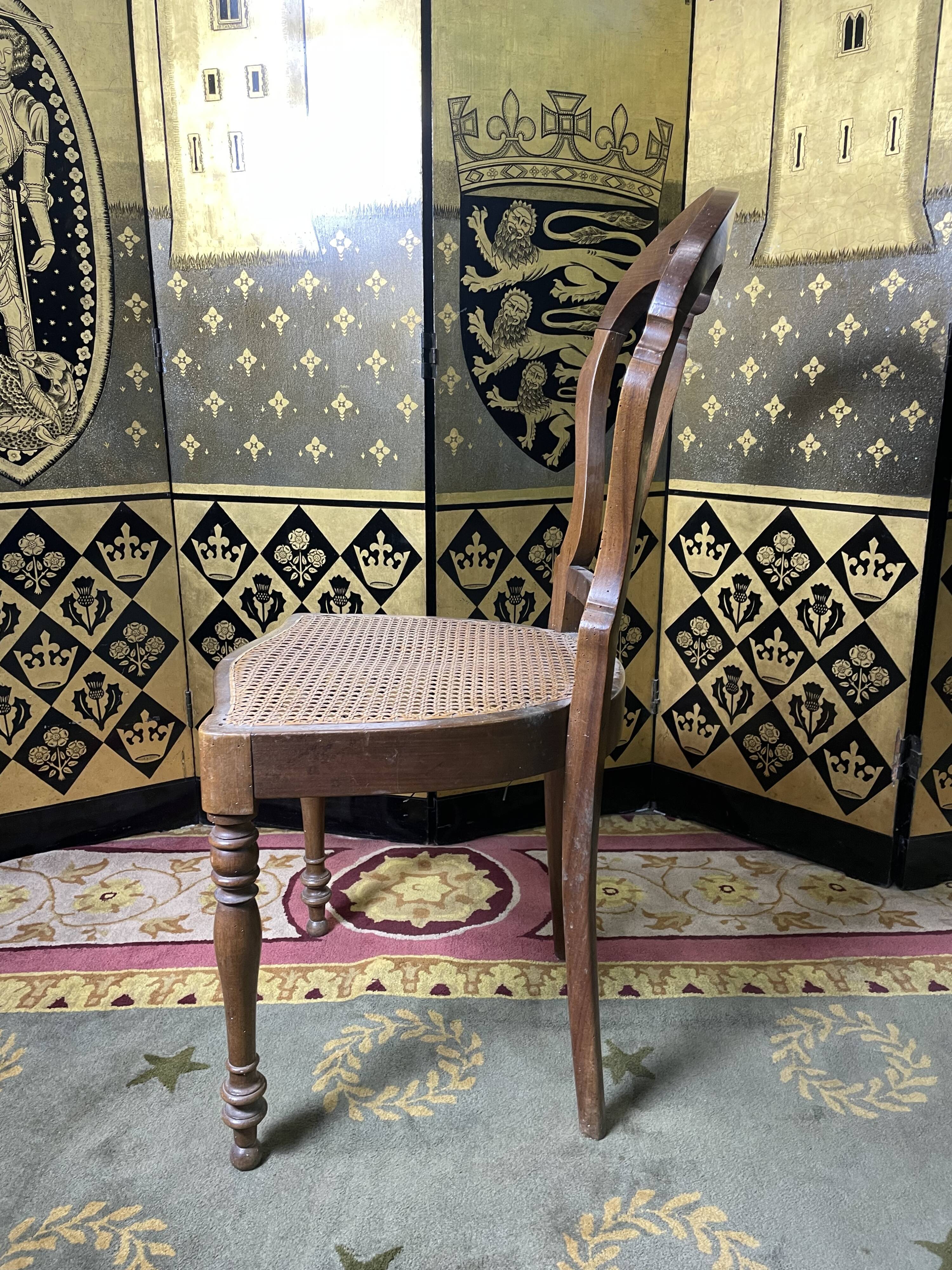 Suite of 12 Louis Philippe period chairs in walnut and canning