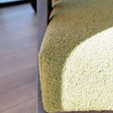 Vintage armchair in moss green bouclé design by H. Lis.