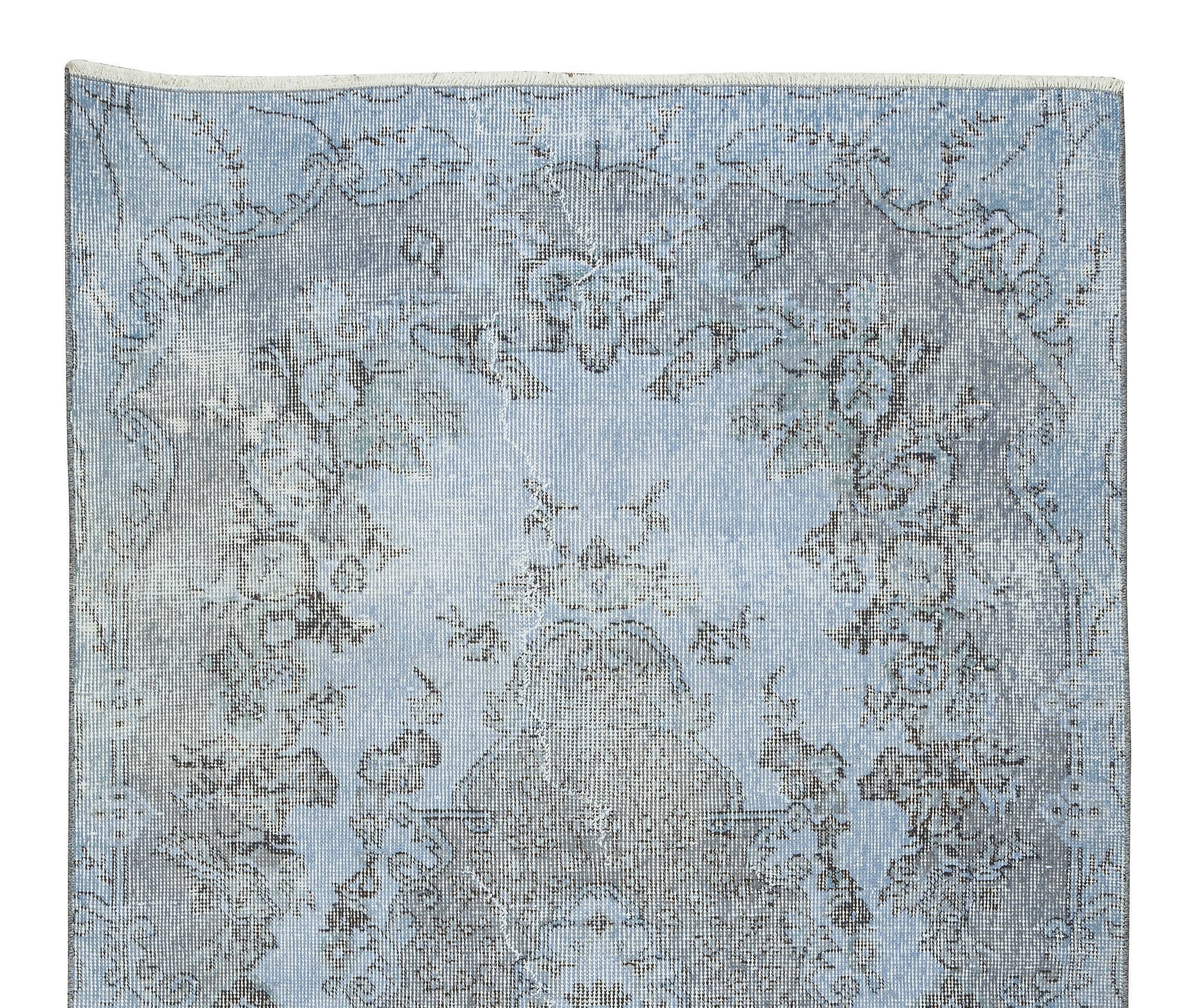 Mid-20th century hand-knotted turkish rug over-dyed in light blue. tek0394
