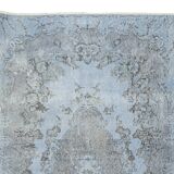Mid-20th century hand-knotted turkish rug over-dyed in light blue. tek0394
