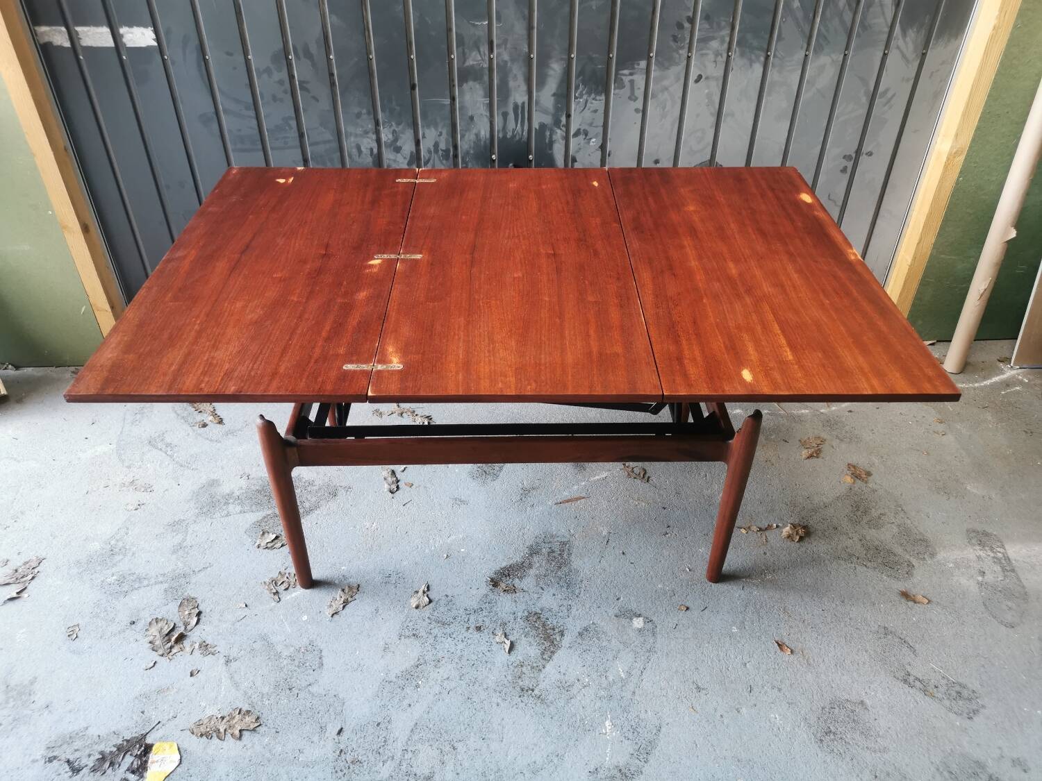 Vintage coffee table with Scandinavian rise and fall system in teak