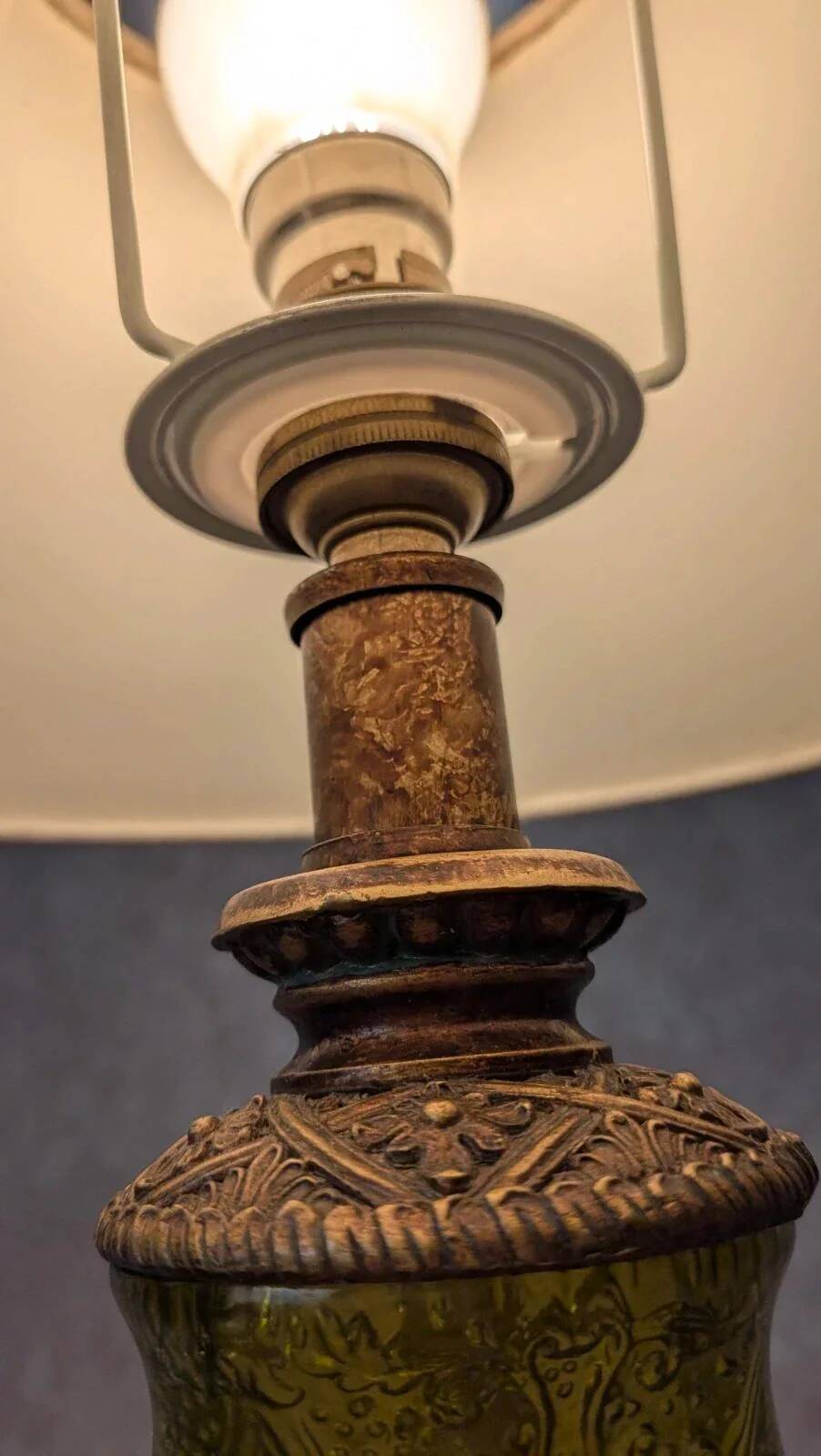 Vintage lamp with bronze imitation base & green relief glass in an antique style.