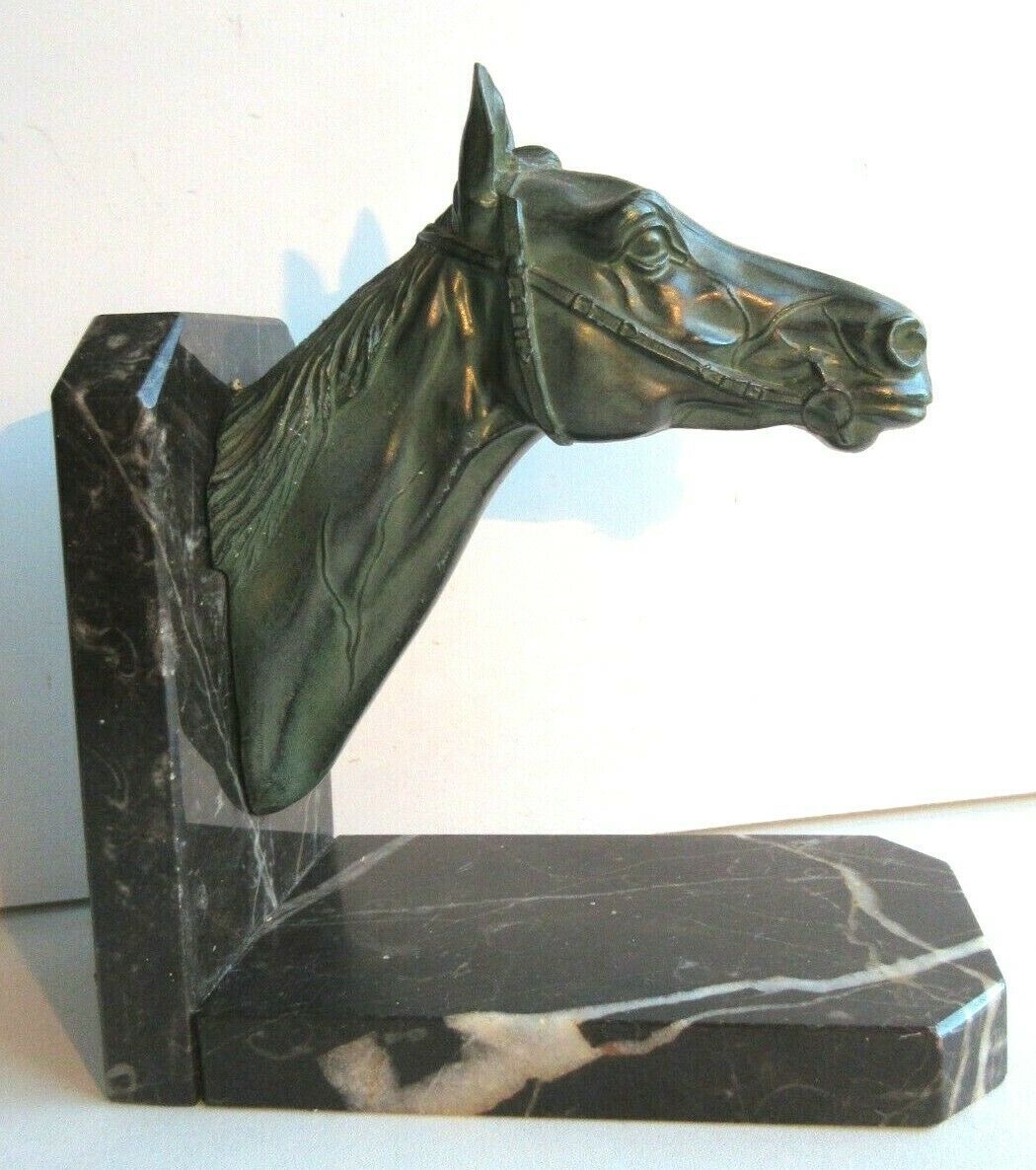 Art-Deco bookend Horse in patinated regulation on black marble support