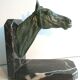 Art-Deco bookend Horse in patinated regulation on black marble support