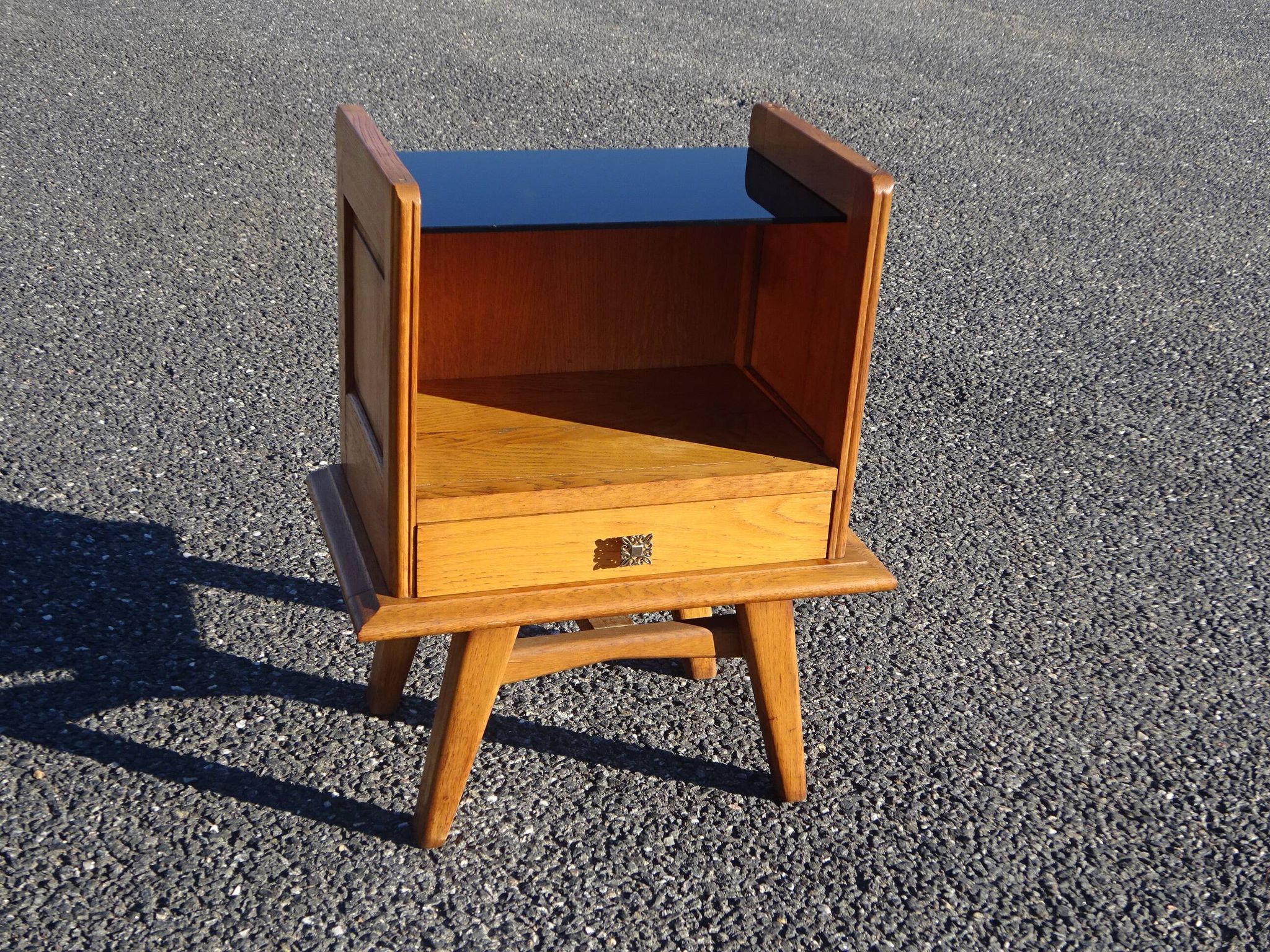 Vintage oak bedside table with tapered legs.