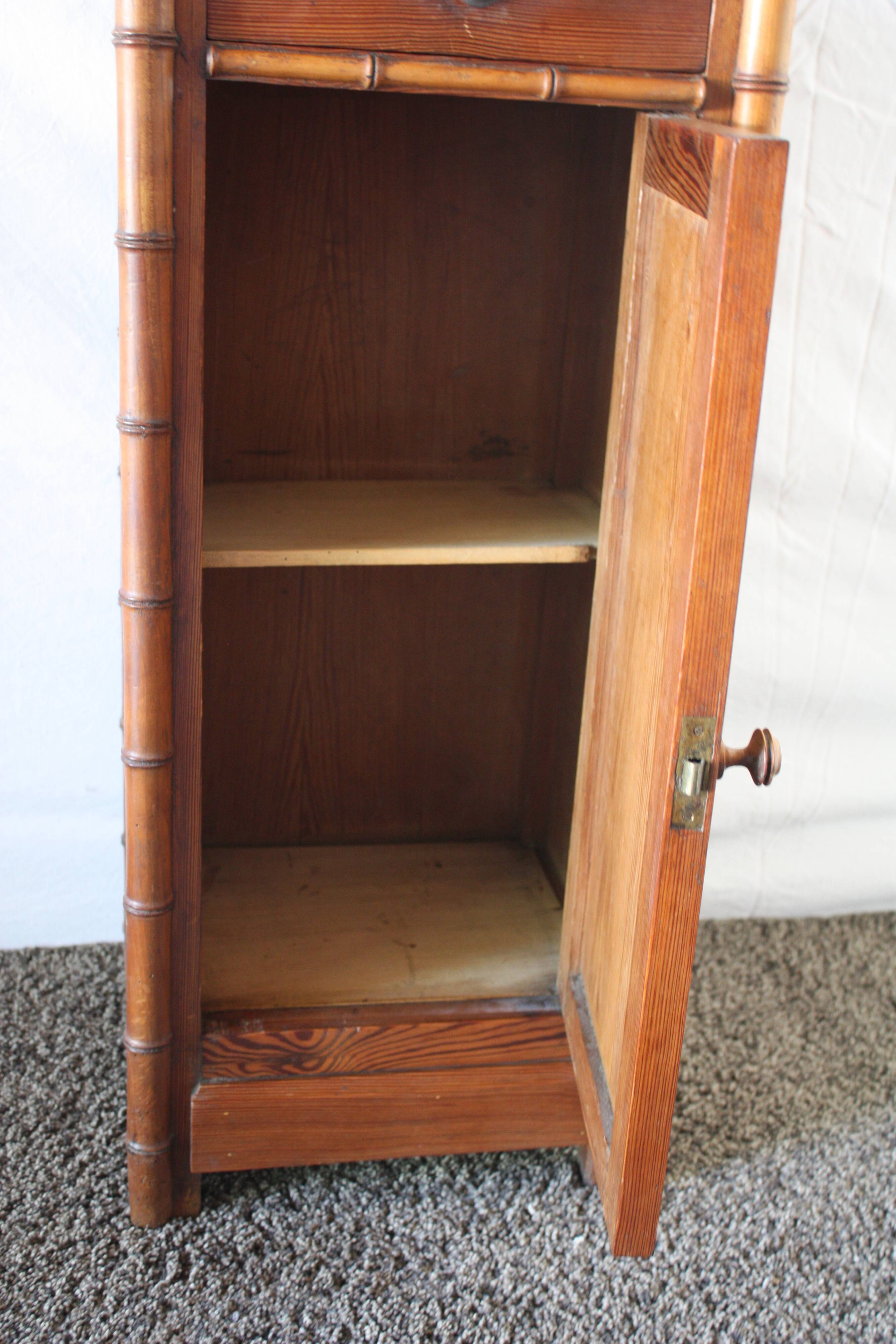 Pitchpin and bamboo beside table 1900