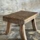 Small stool, rectangular solid teak side table with curved legs.