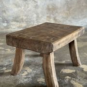 Small stool, rectangular solid teak side table with curved legs.
