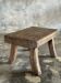 Small stool, rectangular solid teak side table with curved legs.