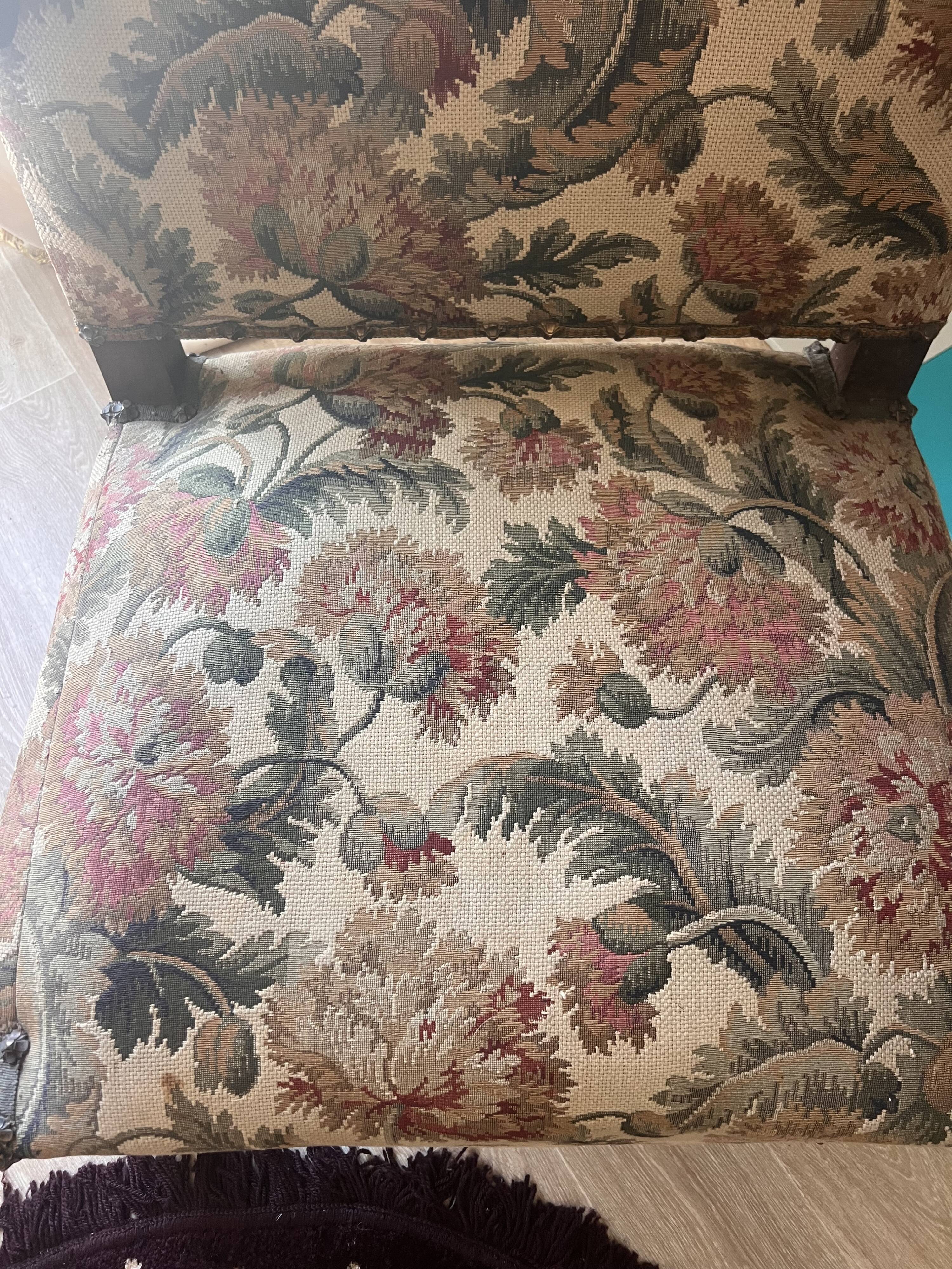 Antique armchair in Henri II style with masks