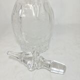 Bouteille en verre sculpté