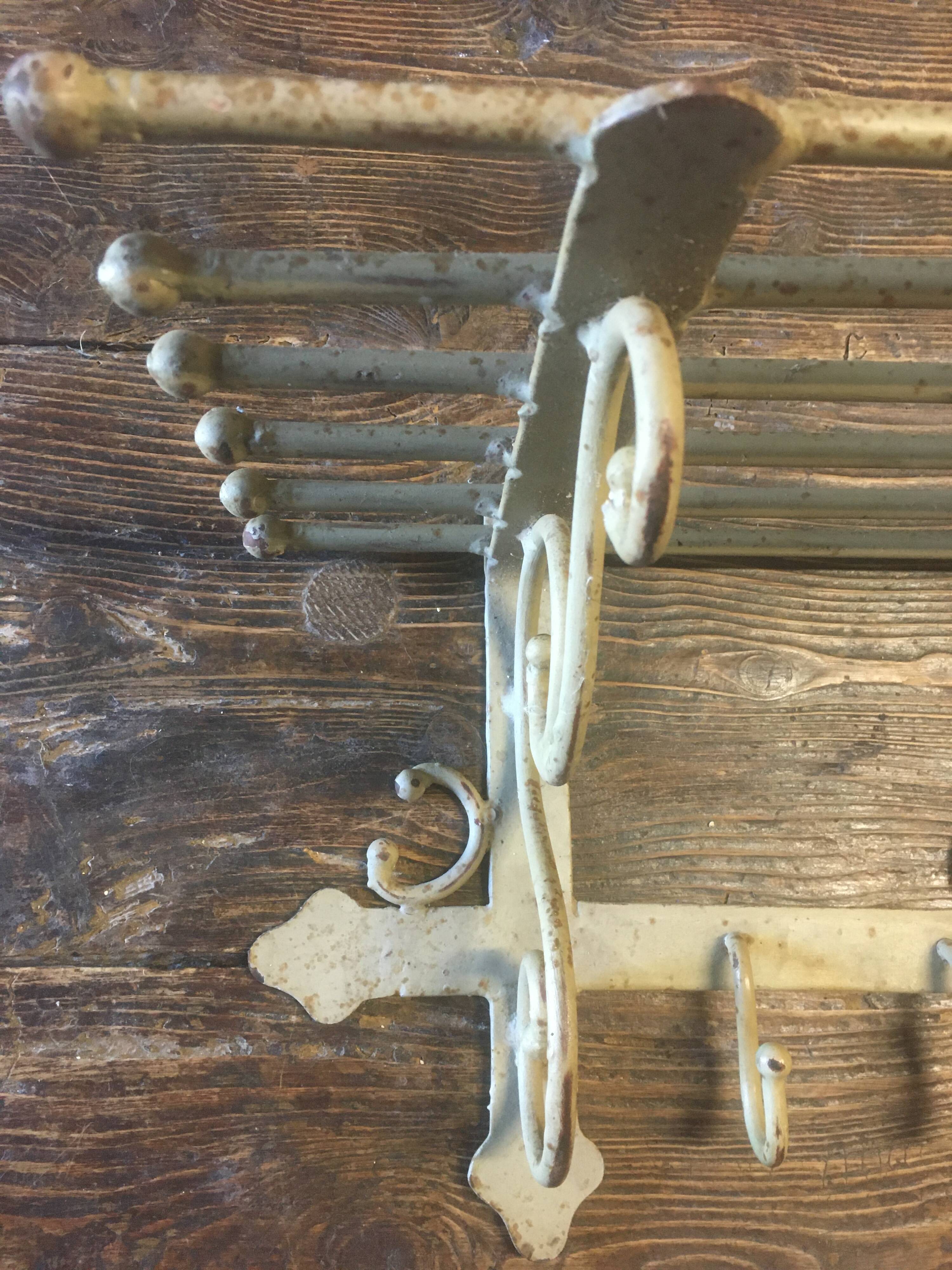 White wrought iron coat and hat rack