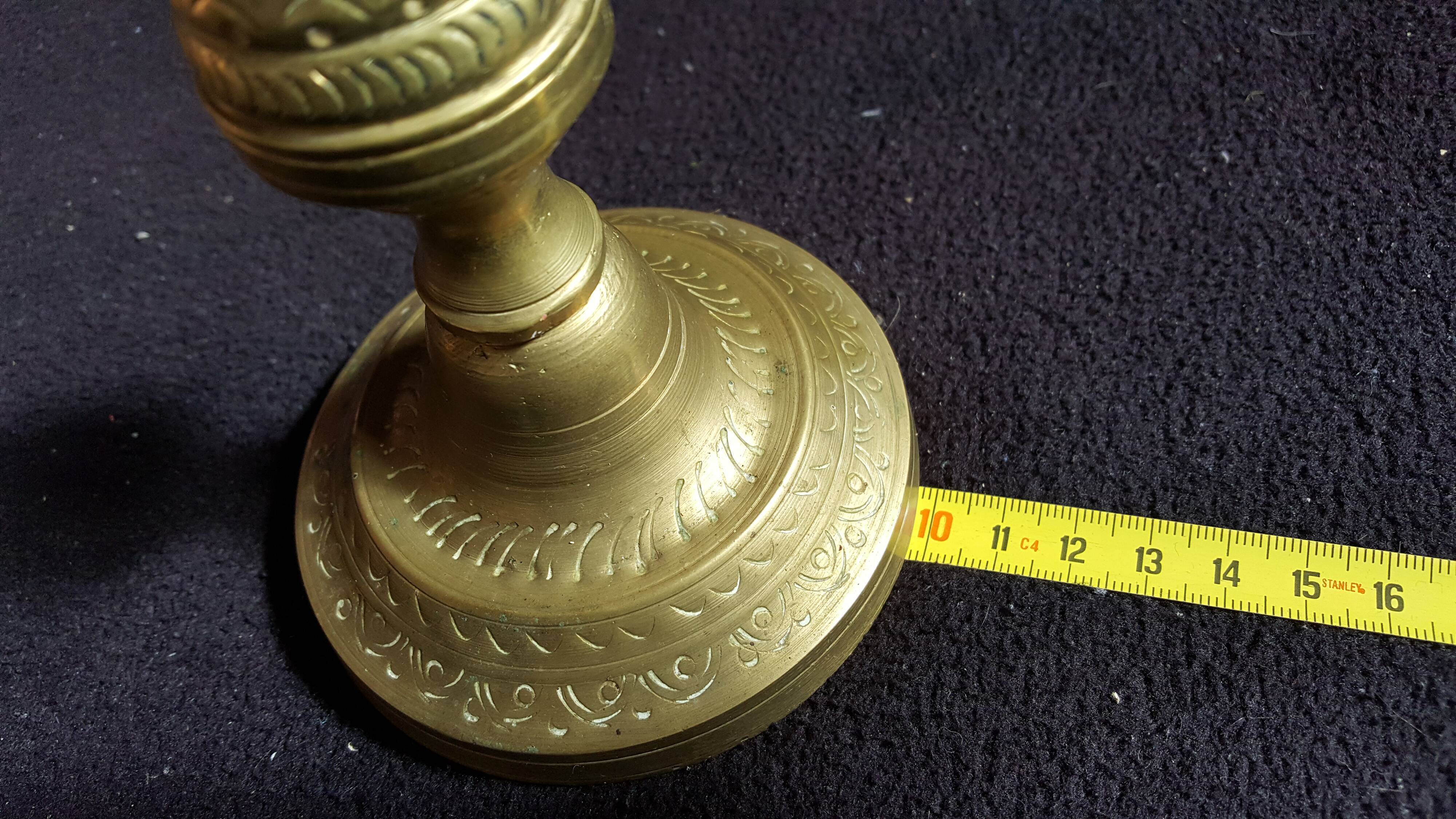 Former pair of bronze candlesticks