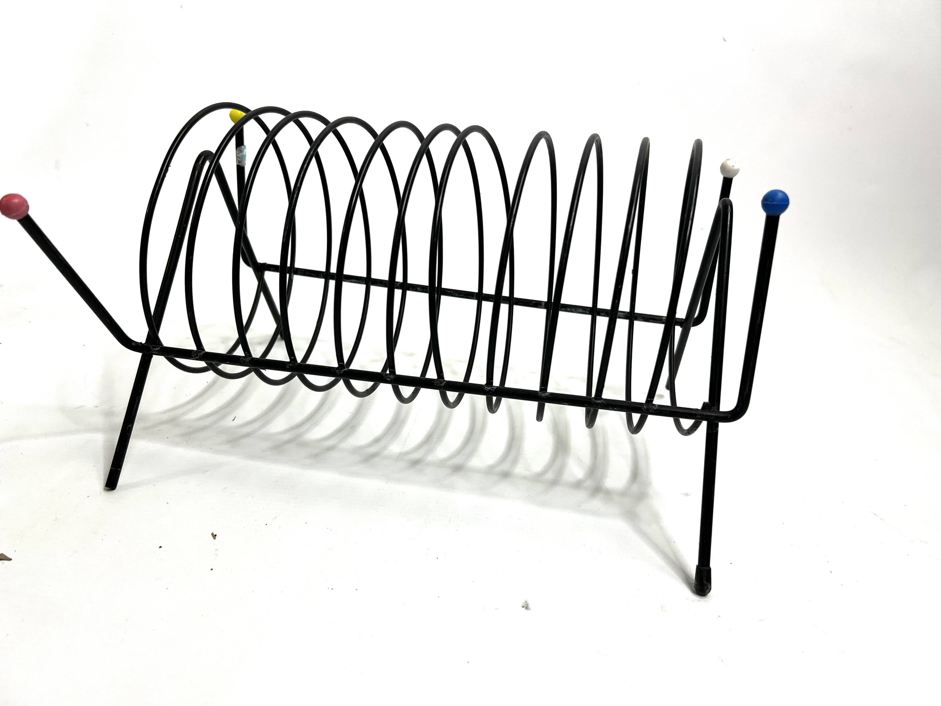 Porte-revues vintage en métal laqué noir – Design 1950s multicolore