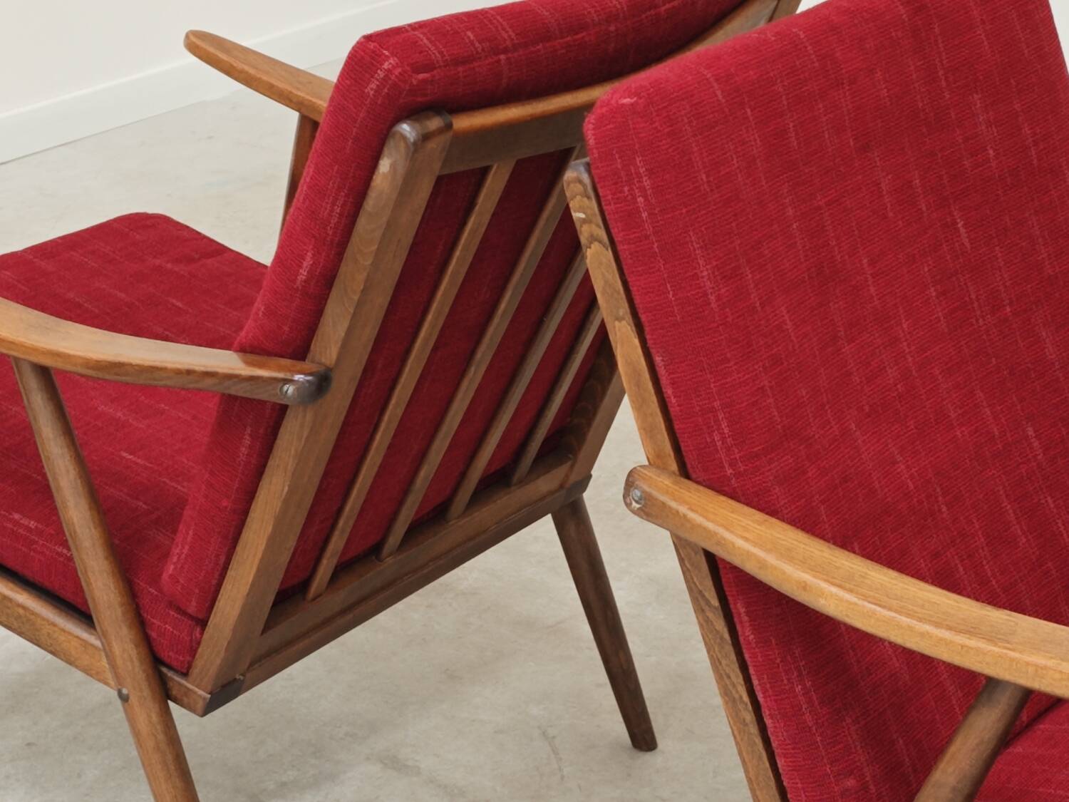 Pair of burgundy boomerang armchairs Antonin Suman Ton Bystrice (Thonet)