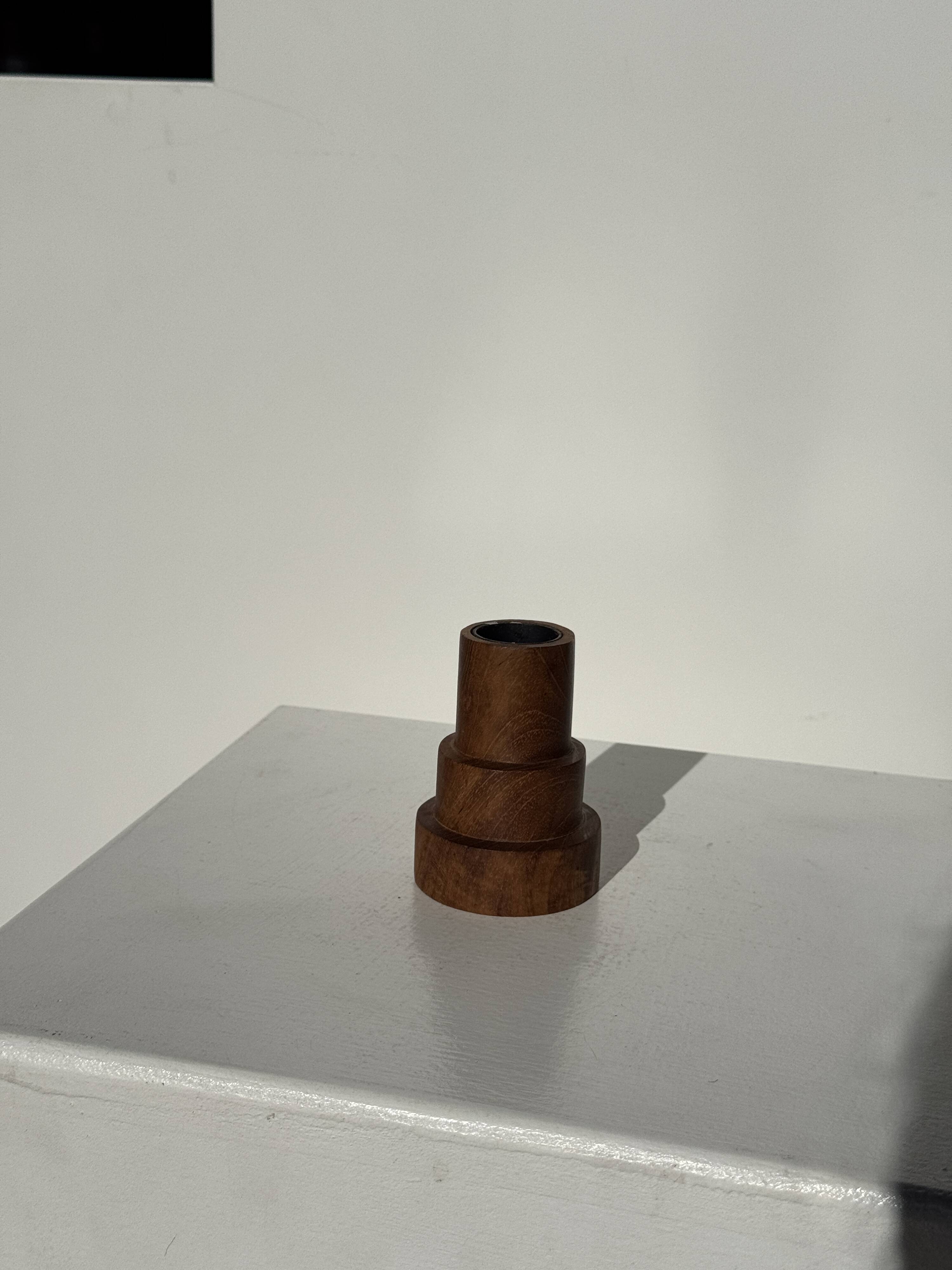 Pyramidal circular teak monoxyle candlestick H7 D5