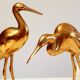 Couple of heron in vintage golden brass