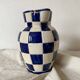 Antique blue and white checkered pitcher