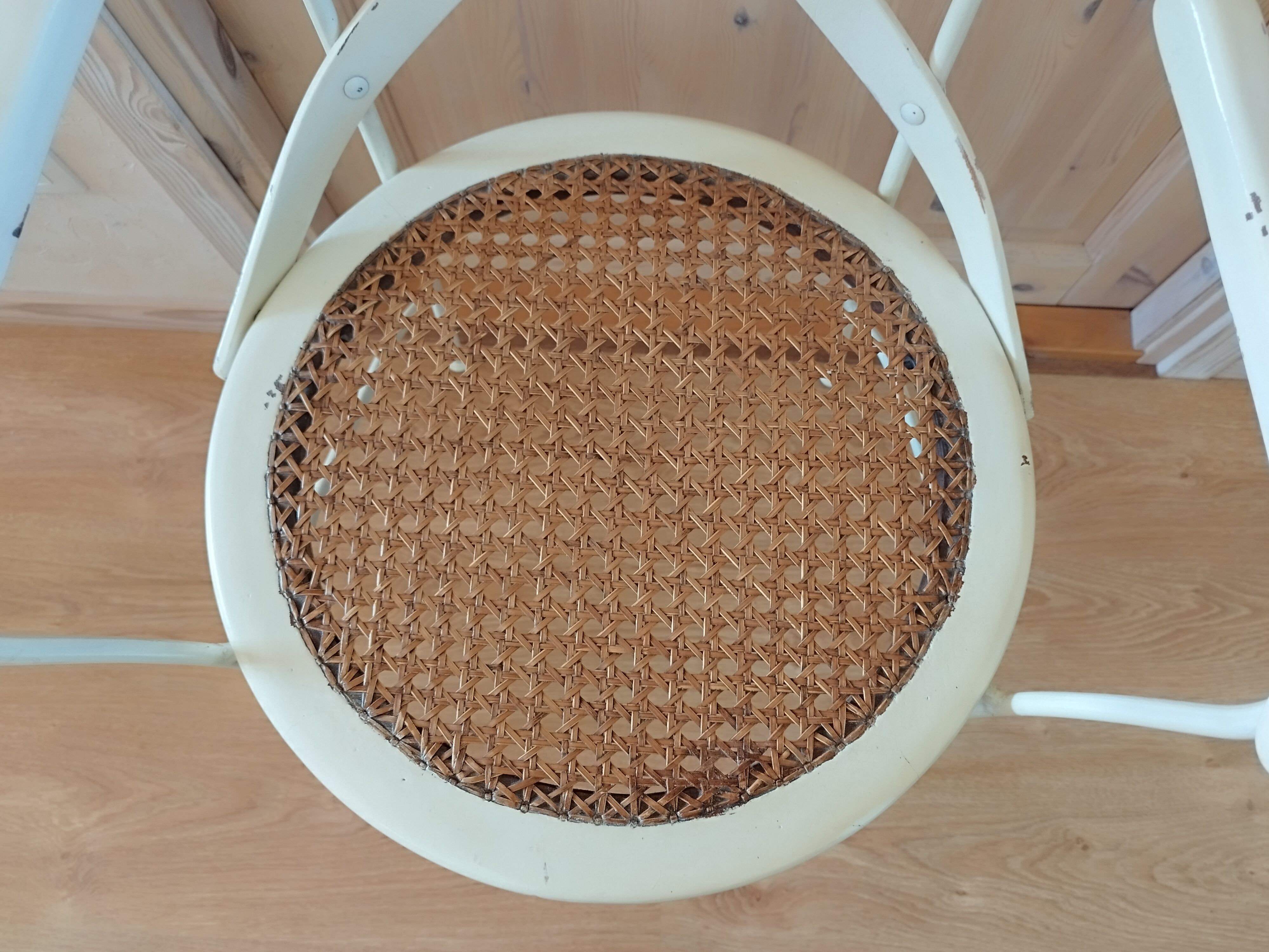 Canned chair with wooden and metal braces