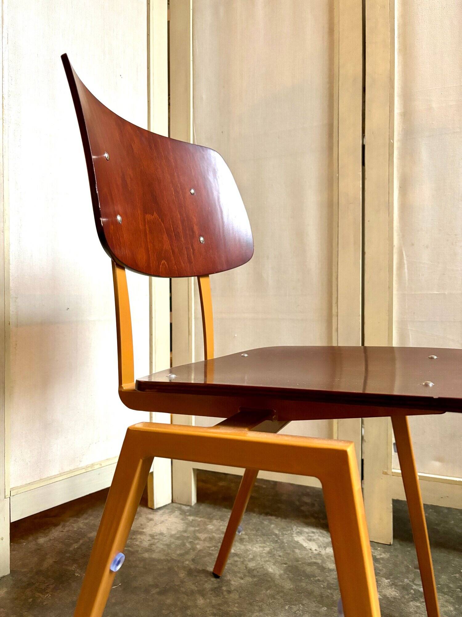 Chair in dark wood and ocher metal