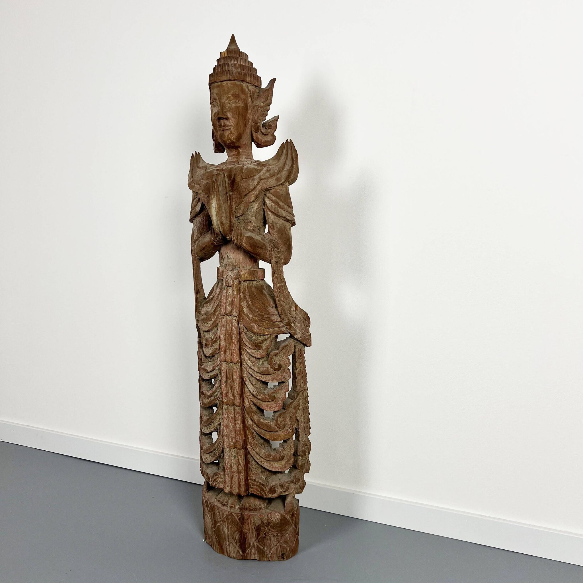 Large carved wooden statuette of a kinaree worshipping a devi. Thailand