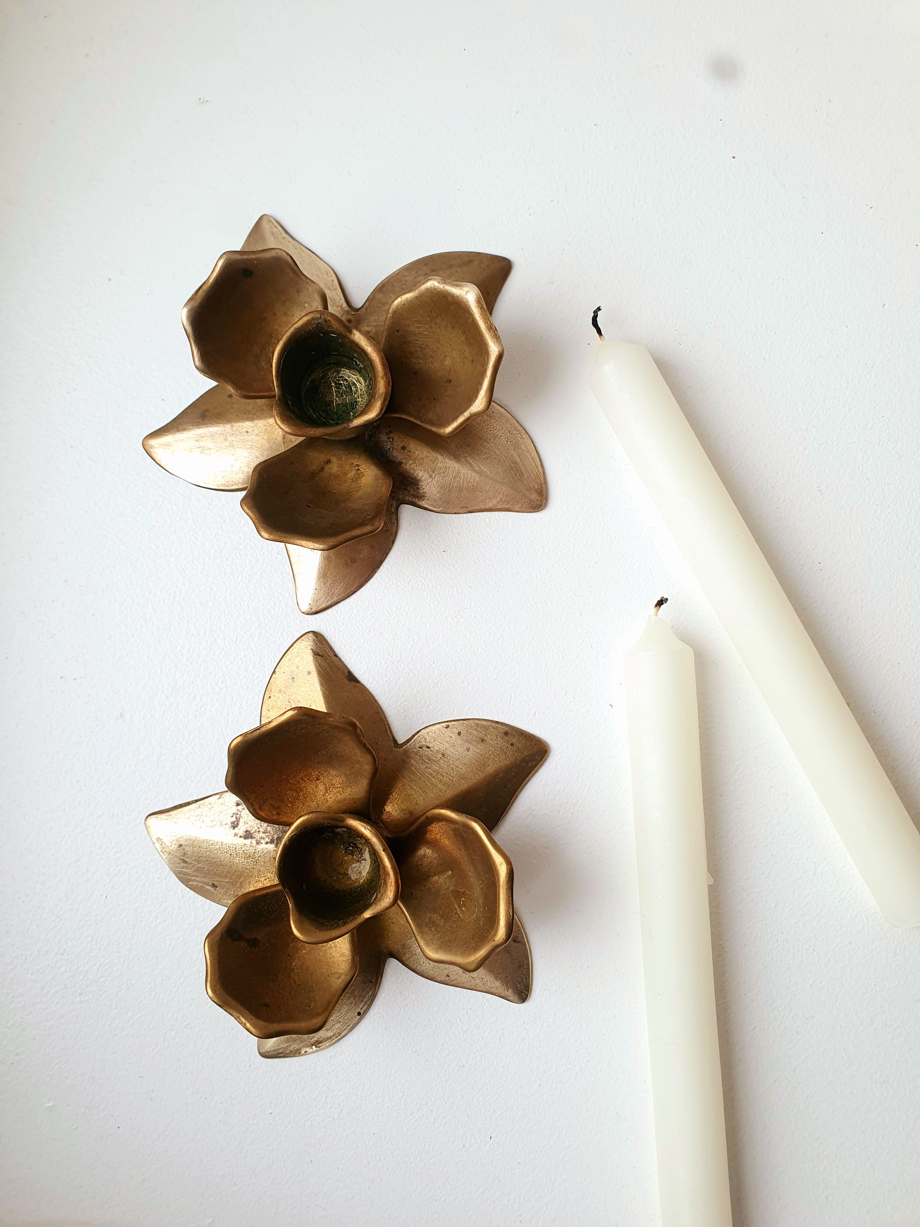 Two brass flower candlesticks