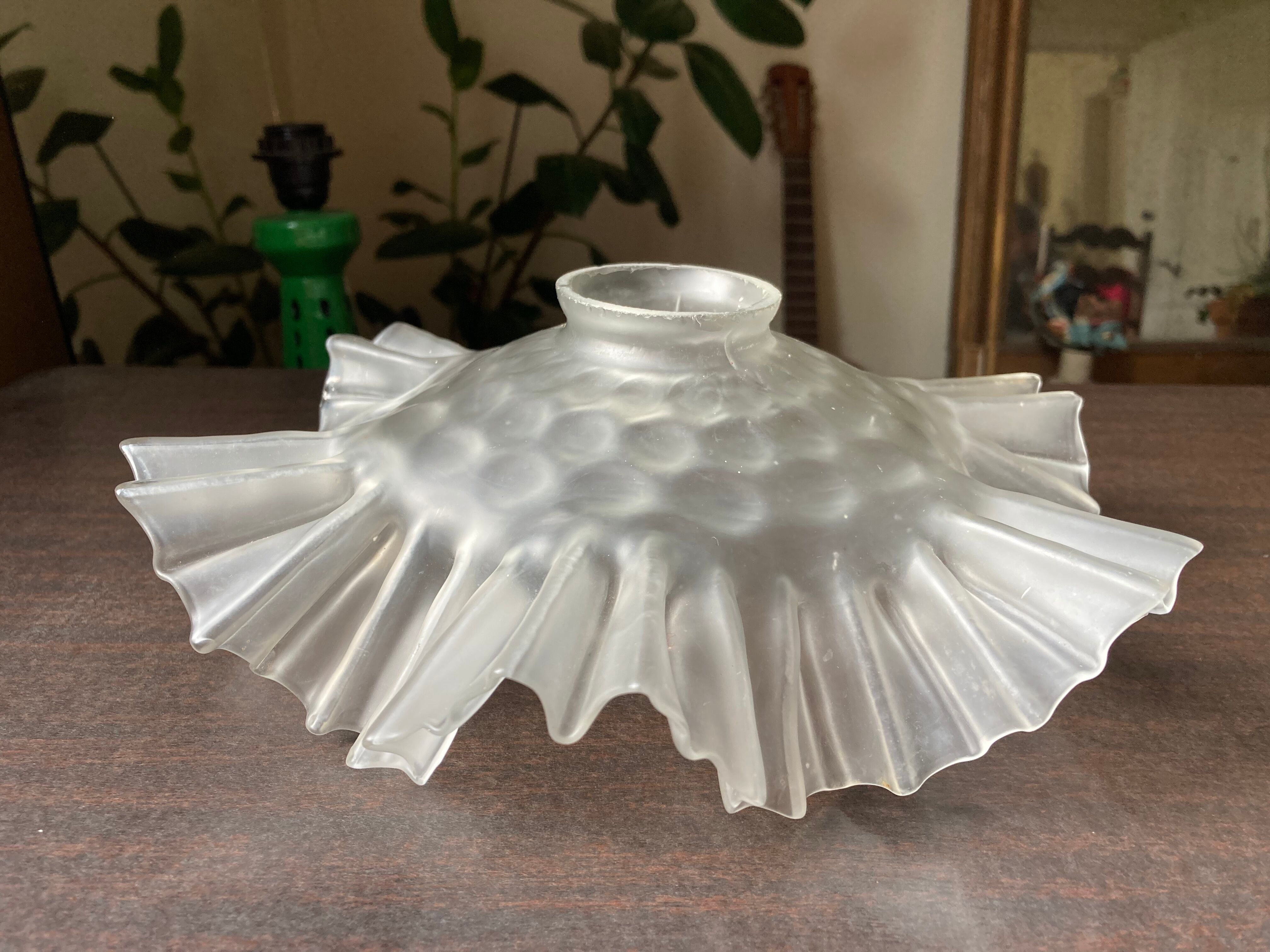 Transparent molded glass suspension in flower shape