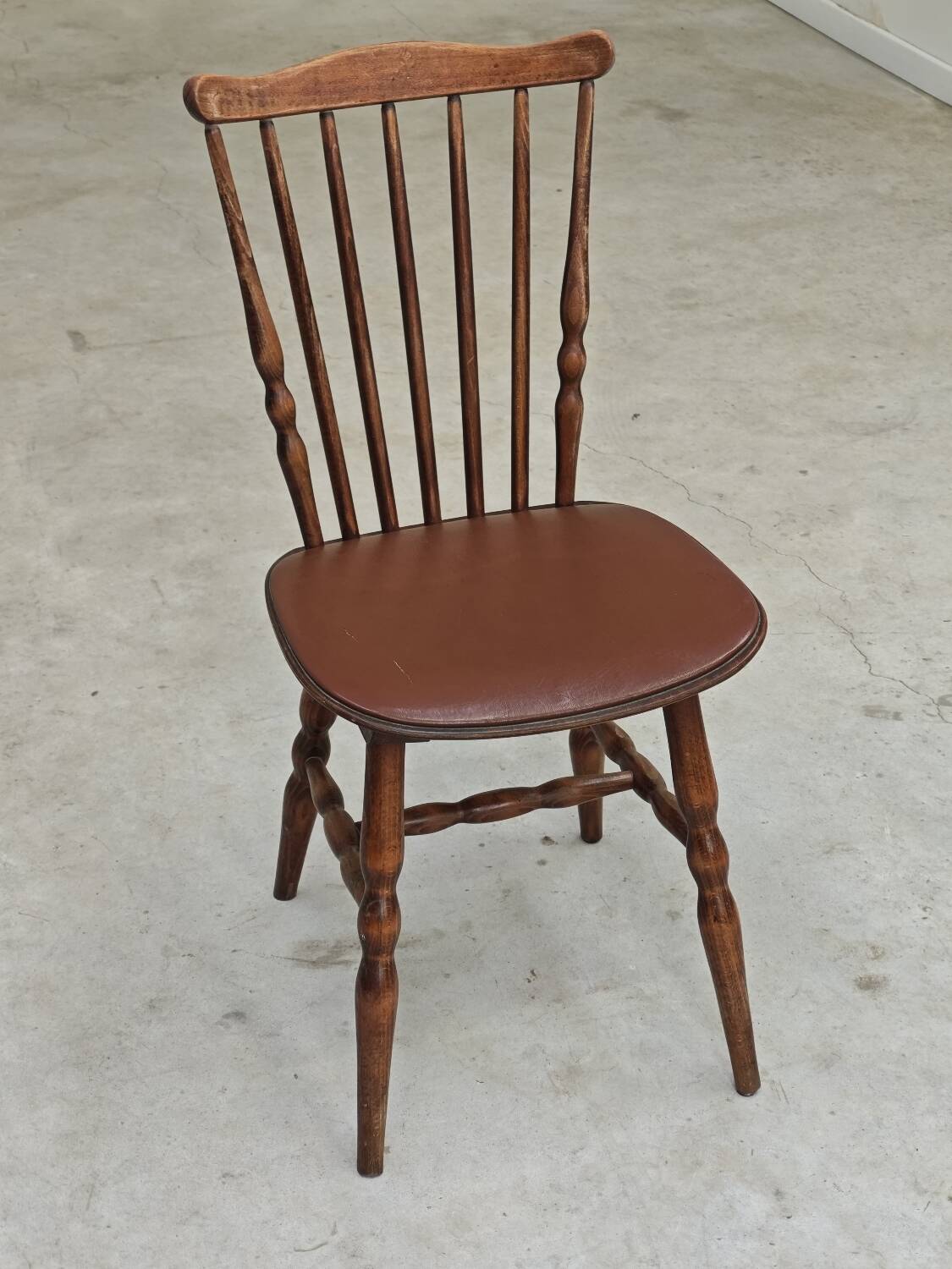Baumann Tacoma bistro chair, wood and brown faux leather, 1960.